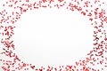 Valentine`s Day background - a frame of scattered heart shaped confetti over white background