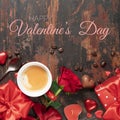 Valentine's day background with fresh cup of coffee, red roses, chocolate and gifts Royalty Free Stock Photo