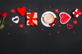 Valentine's Day background. Gift, coffee roses, candles, hearts on black background. Valentines day concept. Flat Royalty Free Stock Photo