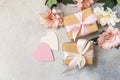 Valentine's Day background with gifts, beautiful flowers and hearts. Royalty Free Stock Photo