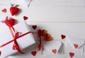 Valentine\'s Day background. Gifts, confetti, envelope on white background