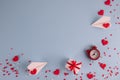 Valentine`s Day background. Gifts, confetti, paper plane on pastel blue background. Valentines day concept. Flat lay, top view