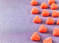 Valentine`s day background. Gummy candy shaped heart sweets.