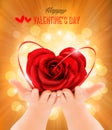 Valentine`s day background. Hands holding heart shaped rose. Royalty Free Stock Photo