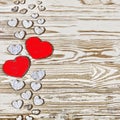 Valentine`s day background. Homemade hearts made of wood on a wooden background. Heart is a symbol of love . Royalty Free Stock Photo