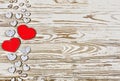 Valentine`s day background. Homemade hearts made of wood on a wooden background. Heart is a symbol of love Royalty Free Stock Photo