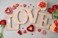 Valentine`s day background with love letters, heart shape chocolate, candles, rose flowers and gift boxes