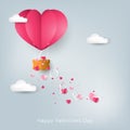 Valentine`s Day background of LOVE text falling from heart shape hot air balloon with tiny pink heart on the sky with cloud.