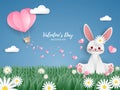 Valentine`s Day background of paper hearts falling from hot air balloon on sky with white clouds and cute rabbit on grass.