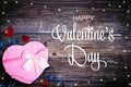Valentine`s Day background with pink gift box, hearts and string lights Royalty Free Stock Photo