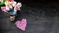 Valentine`s day background - pink heart, flowers, tablet and wedding rings on a dark background Royalty Free Stock Photo