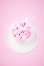 Valentine`s day background with pink marshmallow hearts in a cup Royalty Free Stock Photo