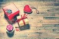 Valentine`s day background with presents and decorative hearts. Royalty Free Stock Photo