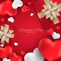 Valentine`s Day background of realistic red gift box with gold ribbon and hearts frame with copy space. Royalty Free Stock Photo