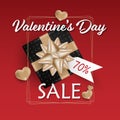 Valentine`s Day background of realistic black gift box with gold ribbon and 70% on white tag and gold hearts with gold frame. Royalty Free Stock Photo