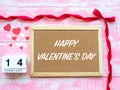 Valentine`s Day Background. Red Heart, 14 February wooden calendar, Flower on Wooden background