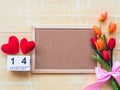 Valentine`s Day Background. Red Heart, 14 February wooden calendar, Flower on Wooden background