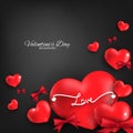 Valentine`s Day background of red heart with love text and red ribbon on black background with copy space. Royalty Free Stock Photo