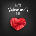 Valentine`s Day background of red heart shape gift box with red ribbon and Happy Valentine`s Day text on black background. Royalty Free Stock Photo