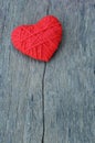 Valentine`s day background with Red heart shape made from thread yarn on old wooden background Royalty Free Stock Photo