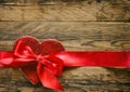 Valentine`s day background, red heart with silk ribbon Royalty Free Stock Photo