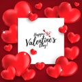 Valentine`s Day background with red hearts and Happy Valentine`s Day text in white frame.