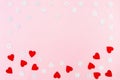 Valentine`s Day background. red hearts and snowflakes on pink background. Valentines day concept. Flat lay, top view, copy space Royalty Free Stock Photo