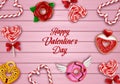 valentine\'s day background with sweets. valentine card with lollipops, candy canes and donuts on wooden background