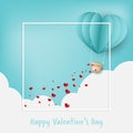 Valentine`s Day background of paper hearts falling from hot air balloon on sky with clouds and Happy Valentine`s Day text.