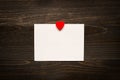 Valentine`s day background. Valentine`s Day card with red heart on the wooden desk.