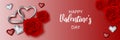 Valentine`s day banner with interwined heart shaped rings, diamonds and red roses