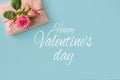 Valentine`s day banner.postcard favorite.Festive wreath of roses decoration with gifts and pink roses on a blue background. Royalty Free Stock Photo