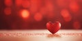 Valentine's day banner. Single heart shape on red background with bokeh and shimmers.