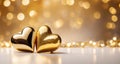 Valentine\'s Day banner with two golden hearts on a blurred gold shiny bokeh background with copy space. Royalty Free Stock Photo