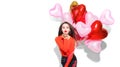 Valentine`s Day. Beauty girl with colorful air balloons having fun Royalty Free Stock Photo