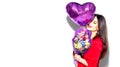 Valentine`s Day. Beauty girl with colorful bouquet of flowers and heart shape air balloon on white background Royalty Free Stock Photo