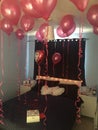 Valentine's Day bedroom decorated with red helium balloons . Royalty Free Stock Photo