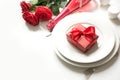 Valentine`s day or birthday dinner. Elegance table setting with champagne and red rose Royalty Free Stock Photo