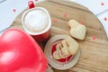 Valentine`s Day, biscuits and balloon-shaped heart and cup of co Royalty Free Stock Photo