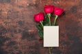 Valentine`s day blank card with red rose flowers on vintage wooden background. Valentines day mockup