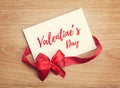 Valentine`s day blank gift card and red ribbon with bow Royalty Free Stock Photo