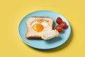 Valentine\'s Day breakfast with egg with tomatoes, heart shaped and toast bread