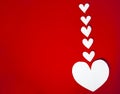 Valentine`s day card concept. white hearts on red background, flat lay Royalty Free Stock Photo