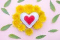 Valentine`s day card, red and white handmade heart on dandelions on a pink background Royalty Free Stock Photo