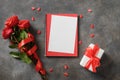 Valentine's day card with romantic gift, red roses. Royalty Free Stock Photo