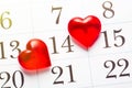Valentine`s day, celebrating love concept. Red hearts marking 14 february Valentines day on calendar page