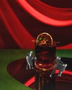 Valentine's day celebration. Young people, couple in elegant clothes dancing tango near giant glass with cocktail Royalty Free Stock Photo