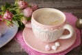 Valentine`s Day Coffee with heart on knitted cup. cappuccino or latte art coffee. Love concept Royalty Free Stock Photo