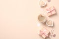 Valentine`s Day composition. Beautiful Flat Lay of gift boxes, coffee cup, candles, hearts on beige background Royalty Free Stock Photo