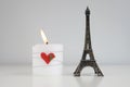 ValentineÃÂ´s Day Composition with Candle and Eiffel Tower Souvenir